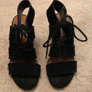 Black suede sandals.